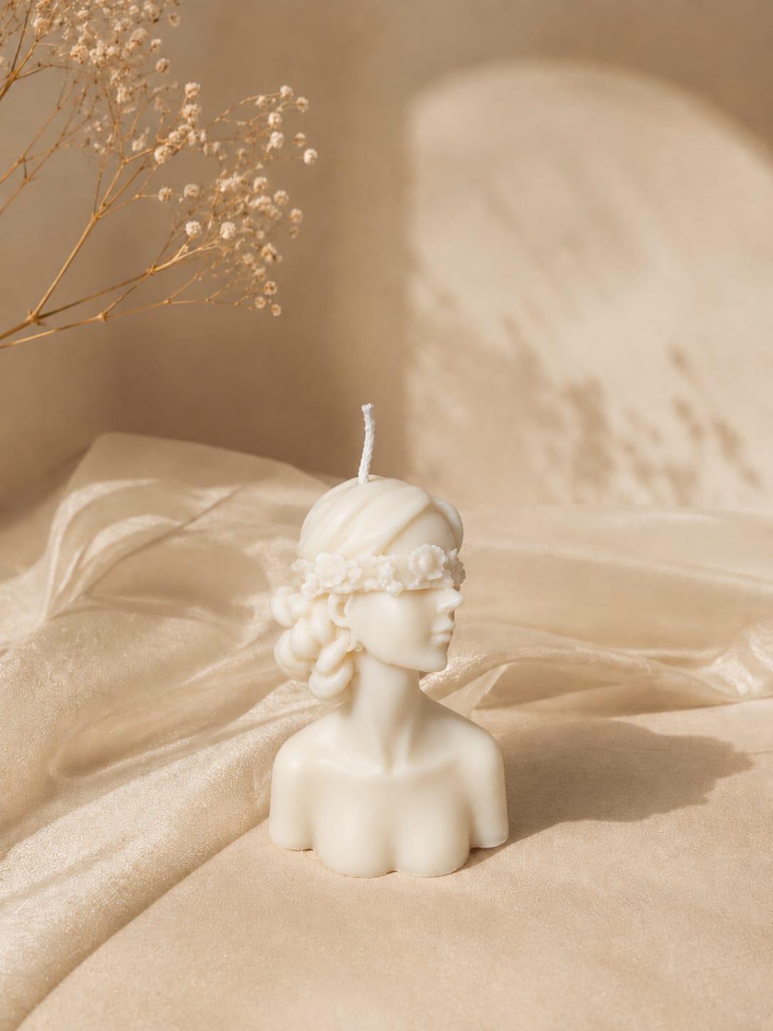 Sculpted woman candle with floral details